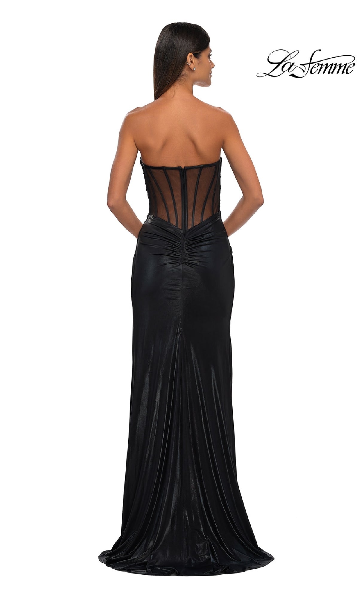A woman faces away in the La Femme 32375, a strapless long metallic prom dress with a sheer back and visible boning. The La Femme logo is shown in the top right corner.